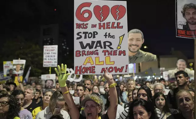 People attend a rally marking 600 days since Israelis were taken hostage by Hamas in Gaza, demanding their release and an end to the war, at a plaza known as the hostages square in Tel Aviv, Israel, Wednesday, May 28, 2025. (AP Photo/Leo Correa)