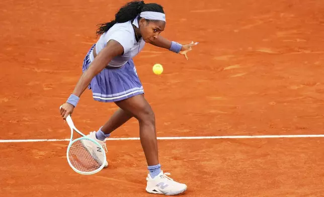 United States' Coco Gauff returns to Aryna Sabalenka of Belarus during the Madrid Open tennis final in Madrid, Spain, Saturday, May 3, 2025. (AP Photo/Jose Breton)