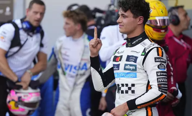 McLaren driver Lando Norris of Britain celebrates his pole position after the qualifying session ahead of the Formula One Monaco Grand Prix race at the Monaco racetrack in Monaco, Saturday, May 24, 2025. (AP Photo/Manu Fernandez)