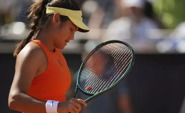 Britain's Emma Raducanu looks down as she plays United States' Coco Gauff during their tennis match at the Italian Open at the Foro Italico, in Rome, Monday, May 12, 2025. (AP Photo/Alessandra Tarantino)