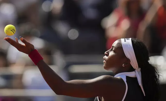 United States' Coco Gauff serves a ball to Britain's Emma Raducanu during their tennis match at the Italian Open at the Foro Italico, in Rome, Monday, May 12, 2025. (AP Photo/Alessandra Tarantino)