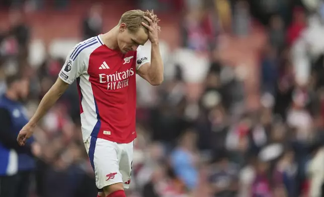 Arsenal's Martin Odegaard leaves the field at the end of the English Premier League soccer match between Arsenal and Bournemouth at Emirates stadium in London, Saturday, May 3, 2025. (AP Photo/Kin Cheung)