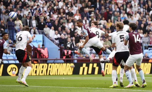 Aston Villa's Youri Tielemans scores the opening goal during the English Premier League soccer match between Aston Villa and Fulham at Villa Park, Birmingham, England, Saturday, May 3, 2025. (Nick Potts/PA via AP)