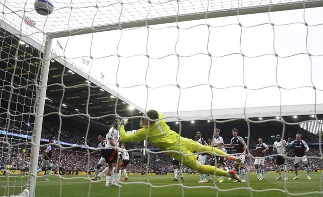 Aston Villa's Youri Tielemans, second from left, scores the opening goal during the English Premier League soccer match between Aston Villa and Fulham at Villa Park, Birmingham, England, Saturday, May 3, 2025. (Nick Potts/PA via AP)