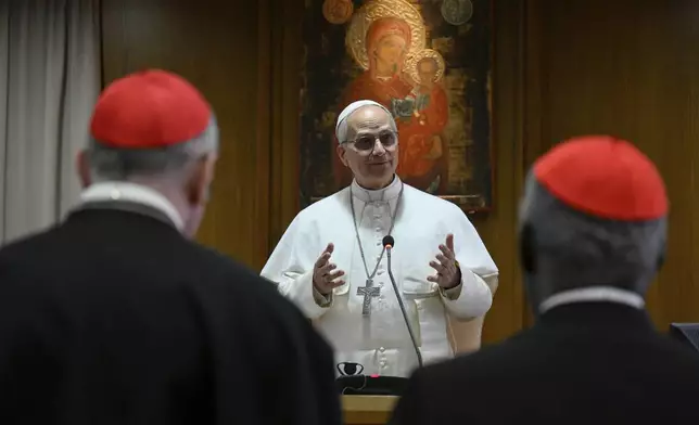 Pope Leo XIV meets the College of Cardinals in the New Synod Hall at the Vatican, Saturday, May 10, 2025. (Vatican Media via AP)