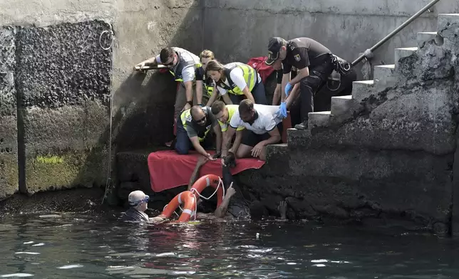 Survivors of a capsized boat are rescued in the port of El Hierro in the Canary Islands, Spain, on Wednesday, May 28, 2025.(Europa Press via AP) *