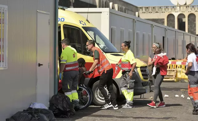 Survivors of a capsized boat are transported by rescue workers in the port of El Hierro in the Canary Islands, Spain, on Wednesday, May 28, 2025. (Fernando Clavijo/Europa Press via AP)