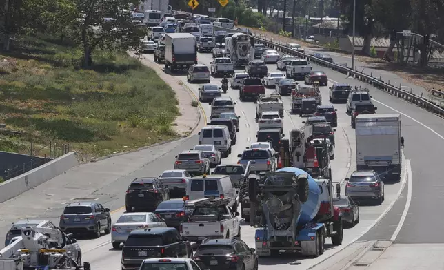 Traffic congestion is experienced ahead of the Memorial Day holiday weekend on the U.S. Highway 101 in Los Angeles on Friday, May 23, 2025. (AP Photo/Damian Dovarganes)