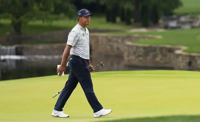 Si Woo Kim, of South Korea, walks on the seventh hole during the second round of the PGA Championship golf tournament at the Quail Hollow Club, Friday, May 16, 2025, in Charlotte, N.C. (AP Photo/David J. Phillip)