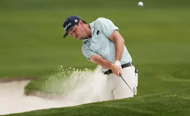 J.T. Poston hits from the bunker on the eighth hole during the second round of the PGA Championship golf tournament at the Quail Hollow Club, Friday, May 16, 2025, in Charlotte, N.C. (AP Photo/George Walker IV)