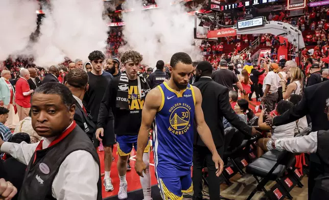 Stephen Curry (30) walks off the court after the Golden State Warriors lost to the Houston Rockets in Game 5 of the First Round of the NBA Playoffs at Toyota Center in Houston, Texas on Wednesday, April 30, 2025. (Carlos Avila Gonzalez/San Francisco Chronicle via AP)