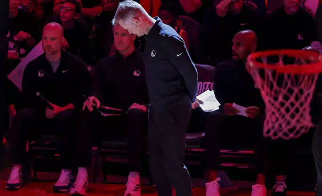 Warriors head coach Steve Kerr stands by the team bench after a timeout in the second half as the Golden State Warriors played the Houston Rockets in Game 5 of the First Round of the NBA Playoffs at Toyota Center in Houston, Texas on Wednesday, April 30, 2025. (Carlos Avila Gonzalez/San Francisco Chronicle via AP)