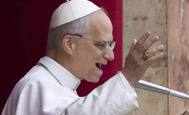 FILE- Pope Leo XIV speaks from the central balcony of St. Peter's Basilica on Sunday, May 11, 2025. (AP Photo/Domenico Stinellis, File)