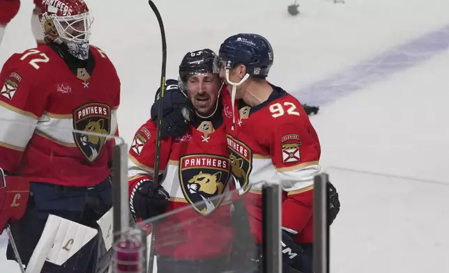 Florida Panthers center Brad Marchand (63) celebrates after scoring the game winning goal during overtime in Game 3 of a second-round NHL hockey playoff series Toronto Maple Leafs, Friday, May 9, 2025, in Sunrise, Fla. (AP Photo/Marta Lavandier)