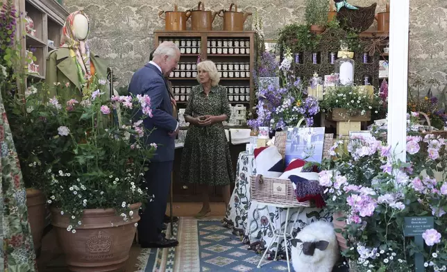Britain's King Charles III, patron of the Royal Horticultural Society, and Queen Camilla visit the Chelsea Flower Show in London, Monday May 19, 2025. (Toby Melville/Pool via AP)