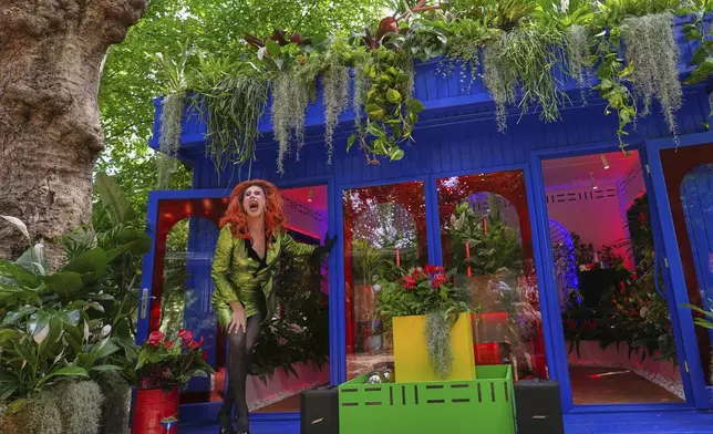 Drag artist Ula Lah performs as Mother Nature at the Babylon Beat indoor Garden at the RHS Chelsea Flower Show in London, Monday, May 19, 2025. (AP Photo/Kirsty Wigglesworth)