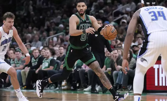 Boston Celtics forward Jayson Tatum (0) drives to the basket against the Orlando Magic during the second half in Game 5 of a first-round NBA playoff basketball series, Tuesday, April 29, 2025, in Boston. (AP Photo/Charles Krupa)