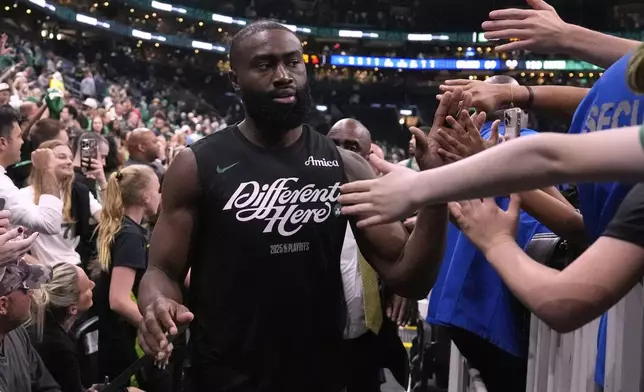 Boston Celtics guard Jaylen Brown is congratulated by fans after eliminating the Orlando Magic following the second half in game 5 of a first-round NBA playoff basketball series, Tuesday, April 29, 2025, in Boston. (AP Photo/Charles Krupa)