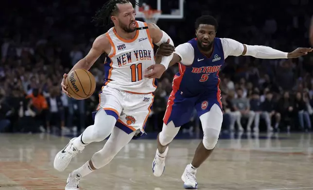New York Knicks guard Jalen Brunson (11) drives past Detroit Pistons guard Malik Beasley in the second half during Game 5 in an NBA basketball first-round playoff series Tuesday, April 29, 2025, in New York. (AP Photo/Adam Hunger)