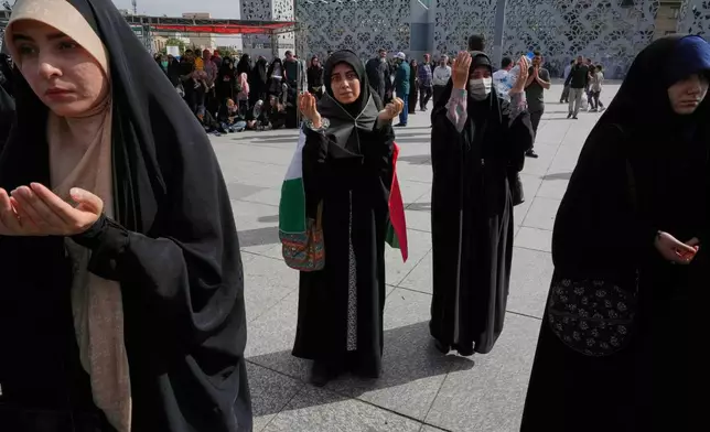 Demonstrators pray during their pro-Palestinian gathering in Tehran, Iran, Friday, May 2, 2025. (AP Photo/Vahid Salemi)