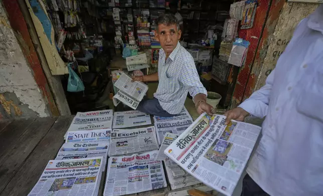 A vendor sells news papers after India Pakistan reported no incidents of firing overnight, at RS Pura, along the International Border, India, Monday, May 12, 2025. (AP Photo/Channi Anand)