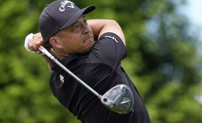 Xander Schauffele watches his tee shot on the 16th hole during a practice round for the PGA Championship golf tournament at the Quail Hollow Club, Wednesday, May 14, 2025, in Charlotte, N.C. (AP Photo/George Walker IV)