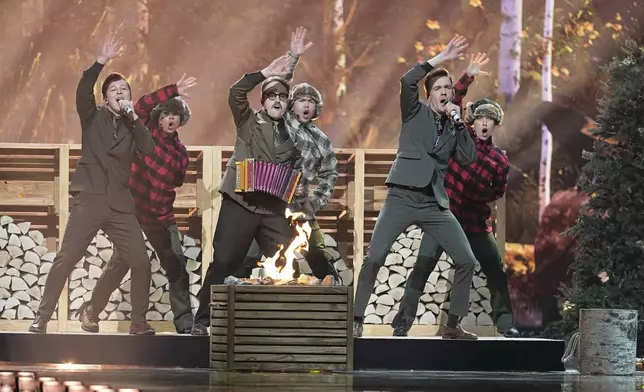 KAJ from Sweden performs the song "Bara Bada Bastu" during the dress rehearsal for the Grand Final of the 69th Eurovision Song Contest, in Basel, Switzerland, Friday, May 16 2025. (AP Photo/Martin Meissner)