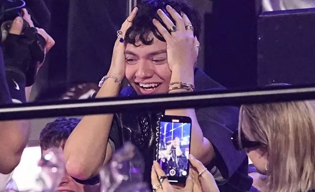 JJ from Austria who performed the song "Wasted Love" reacts to voting during the Grand Final of the 69th Eurovision Song Contest, in Basel, Switzerland, Saturday, May 17, 2025. (AP Photo/Martin Meissner)