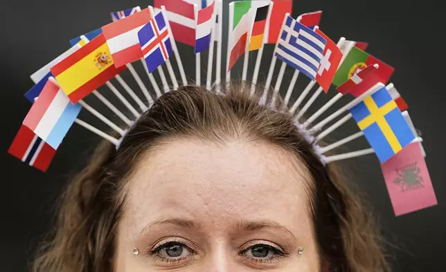 A Eurovision fan is pictured in the cue to the Grand Final of the 69th Eurovision Song Contest, in Basel, Switzerland, Saturday, May 17, 2025. (AP Photo/Martin Meissner)