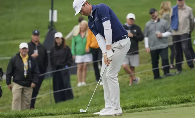 Ben Griffin hits onto the 18th green during the second round of the Memorial golf tournament Friday, May 30, 2025, in Dublin, Ohio. (AP Photo/Sue Ogrocki)