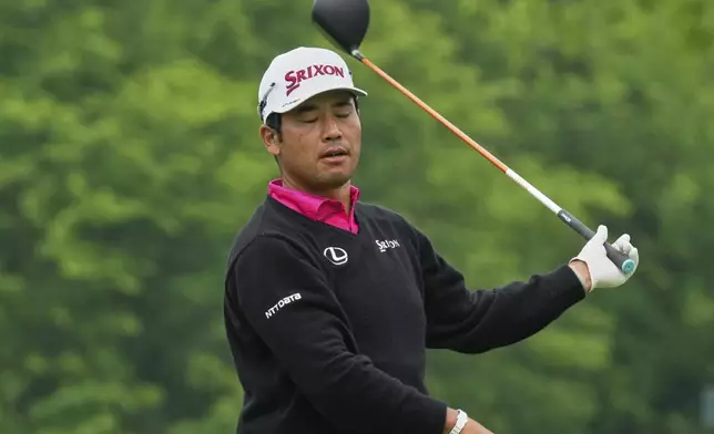 Hideki Matsuyama reacts to his shot after hitting from the 15th tee during the second round of the Memorial golf tournament Friday, May 30, 2025, in Dublin, Ohio. (AP Photo/Sue Ogrocki)