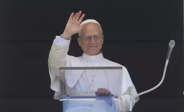 Pope Leo XIV blesses faithful and pilgrims gathered in St. Peter's Square for the Regina Caeli noon prayer, Sunday, May 25, 2025. (AP Photo/Andrew Medichini)