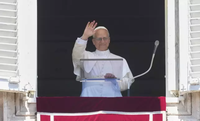 Pope Leo XIV blesses faithful and pilgrims gathered in St. Peter's Square for the Regina Caeli noon prayer, Sunday, May 25, 2025. (AP Photo/Andrew Medichini)