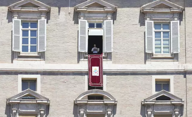 Pope Leo XIV blesses faithful and pilgrims gathered in St. Peter's Square for the Regina Caeli noon prayer, Sunday, May 25, 2025. (AP Photo/Andrew Medichini)