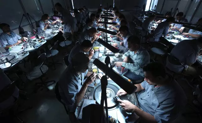 Employees cut and polish diamonds at Shree Ramkrishna Exports in Surat, India, on April 14, 2025. (AP Photo/Ajit Solanki)