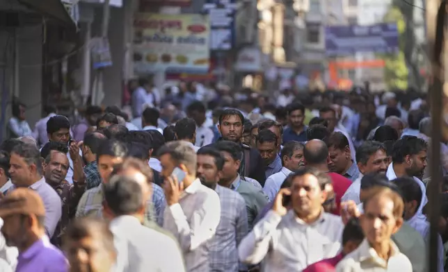 Diamond traders crowd a market street in Surat, India, on April 14, 2025. (AP Photo/Ajit Solanki)