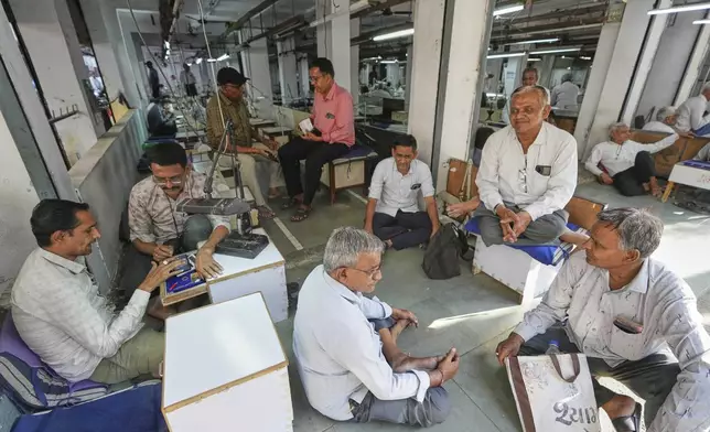 Diamond traders conduct business at a market in Surat, India, on April 14, 2025. (AP Photo/Ajit Solanki)