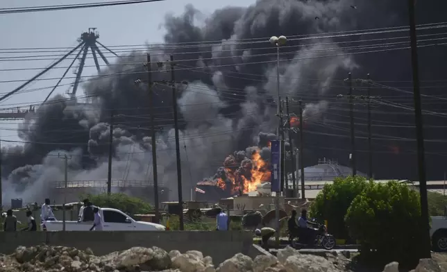 Smoke billows after drone strikes by the paramilitary Rapid Support Forces (RSF) targeted the northern port in the Red Sea city of Port Sudan, Sudan, Tuesday, May 6, 2025. (AP Photo)