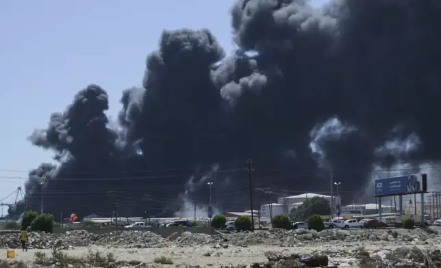 Smoke billows after drone strikes by the paramilitary Rapid Support Forces (RSF) targeted the northern port in the Red Sea city of Port Sudan, Sudan, Tuesday, May 6, 2025. (AP Photo)