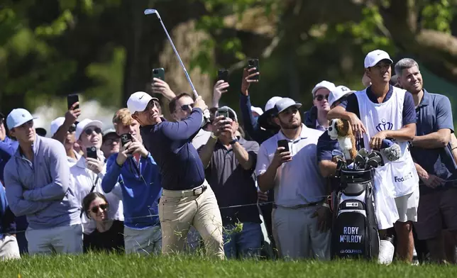 Rory McIlroy, of Northern Ireland, watches his shot on the seventh hole during the third round of the Truist Championship golf tournament at the Philadelphia Cricket Club, Saturday, May 10, 2025, in Flourtown. (AP Photo/Matt Rourke)