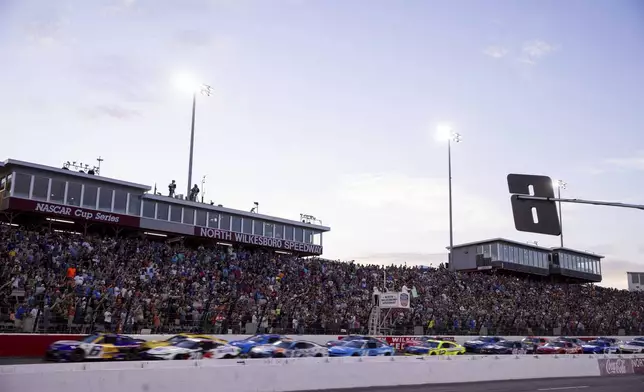 The green flag drops to start the NASCAR All-Star auto race Sunday, May 18, 2025, in North Wilkesboro, N.C. (AP Photo/Scott Kinser)