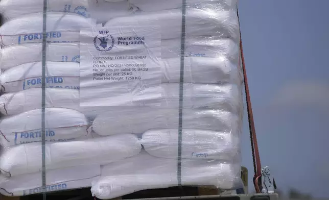 Trucks carrying humanitarian aid for the Gaza Strip are seen at the Kerem Shalom Crossing in southern Israel, Monday, May 19, 2025. A day after Israel said it would resume allowing aid into the territory. (AP Photo/Ohad Zwigenberg)