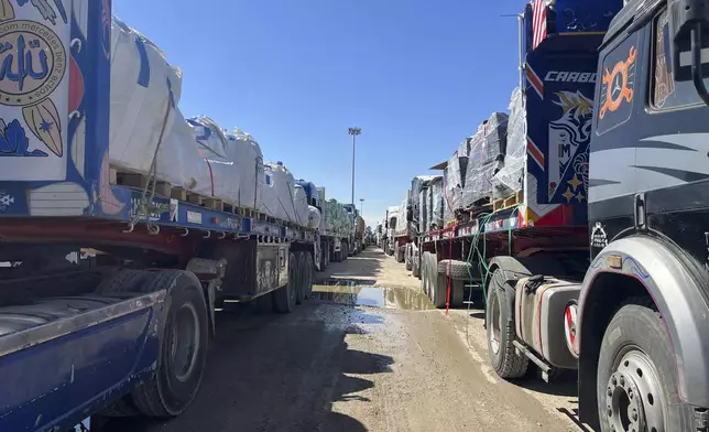 FILE.- Trucks line up at the Egyptian side of the Rafah border crossing between Egypt and the Gaza Strip after Israel blocked the entry of aid trucks into Gaza, Sunday, March 2, 2025. (AP Photo/Mohamed Arafat,File)