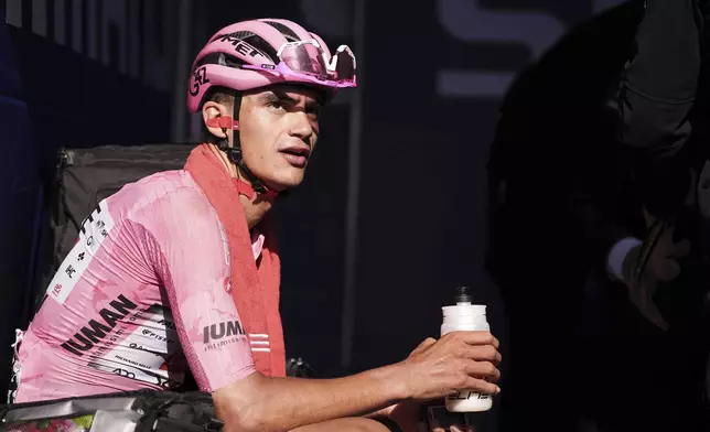 Mexico's Isaac Del Toro Romero of Uae Team Emirates Xrg, wearing the leader pink jersey, looks on after finishing the stage 16 of the Giro d'Italia from Piazzola sul Brenta to San Valentino, Italy, Tuesday, May 27, 2025. (Marco Alpozzi/LaPresse via AP)