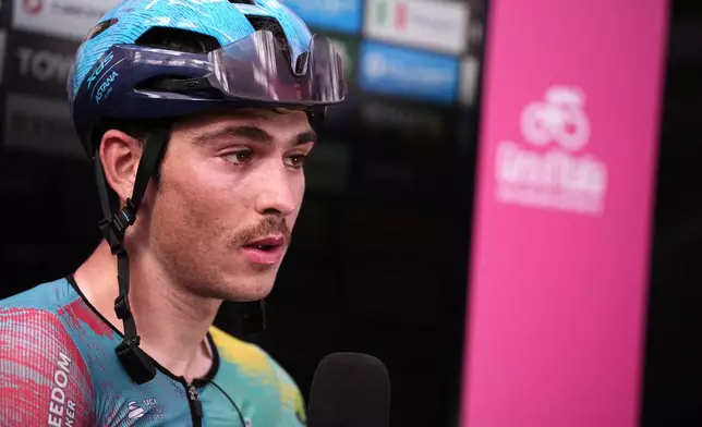 Italy's Christian Scaroni of Xds Astana Team speaks to the media after winning the stage 16 of the Giro d'Italia from Piazzola sul Brenta to San Valentino, Italy, Tuesday, May 27, 2025. (Marco Alpozzi/LaPresse via AP)