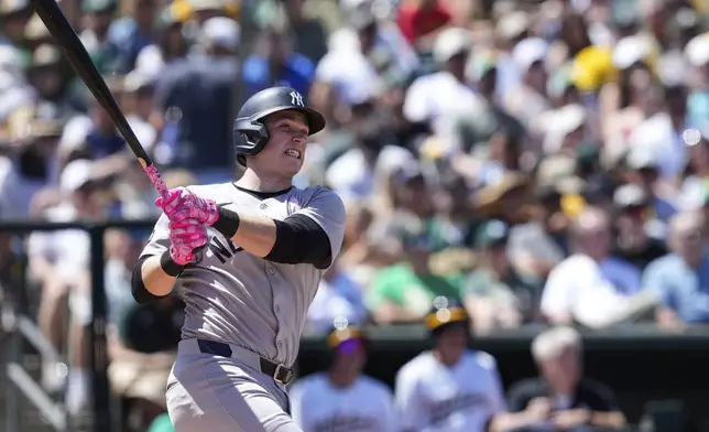 New York Yankees' Ben Rice hits a grand slam during the fifth inning of a baseball game against the Athletics, Sunday, May 11, 2025, in West Sacramento, Calif. (AP Photo/Godofredo A. Vásquez)