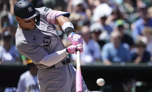 New York Yankees' Aaron Judge hits a double during the fourth inning of a baseball game against the Athletics, Sunday, May 11, 2025, in West Sacramento, Calif. (AP Photo/Godofredo A. Vásquez)