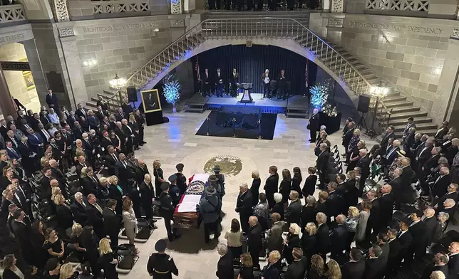 The casket of former Missouri Gov. and U.S. Sen. Christopher "Kit" Bond is brought into the Rotunda of the Missouri Capitol for a memorial service on Tuesday, May 20, 2025, in Jefferson City, Missouri. (AP Photo/David A. Lieb)