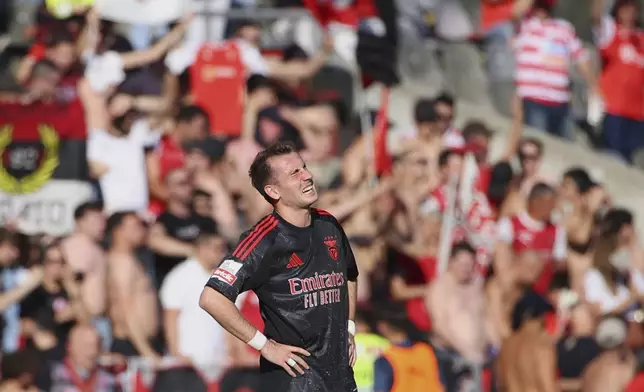 Benfica's Kerem Akturkoglu reacts after Braga's Rodrigo Zalazar scored the opening goal during the Portuguese league last round soccer match between SC Braga and SL Benfica at the Municipal stadium in Braga, Portugal, Saturday, May 17, 2025. (AP Photo/Luis Vieira)