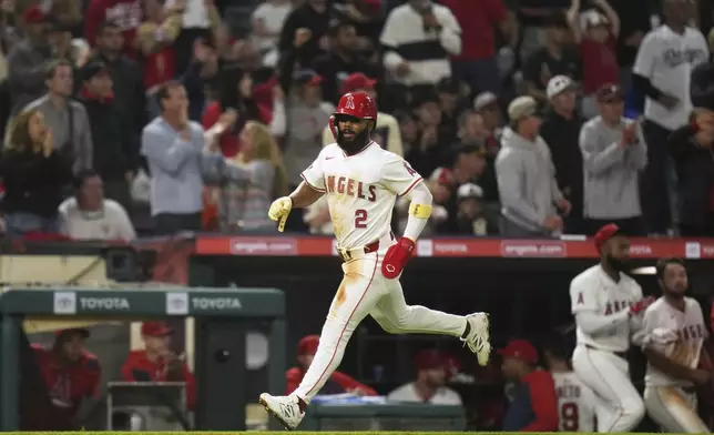 Los Angeles Angels' Luis Rengifo (2) comes around to score on a single by Kyren Paris during the sixth inning of a baseball game against the Detroit Tigers, Saturday, May 3, 2025, in Anaheim, Calif. (AP Photo/Jae C. Hong)